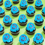 Corporate Cupcakes with Logos featuring vibrant blue frosting and edible printed logo plaques by Crumbs & Doilies.